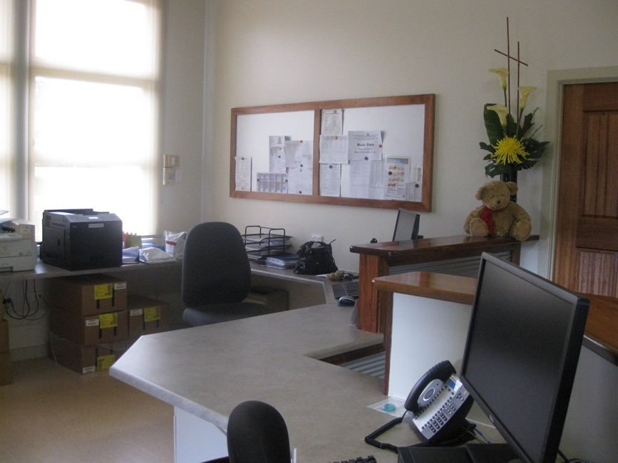 A Teddy Bear Sits On A Desk In An Office — Sven Margraf Constructions Pty Ltd In Atherton QLD