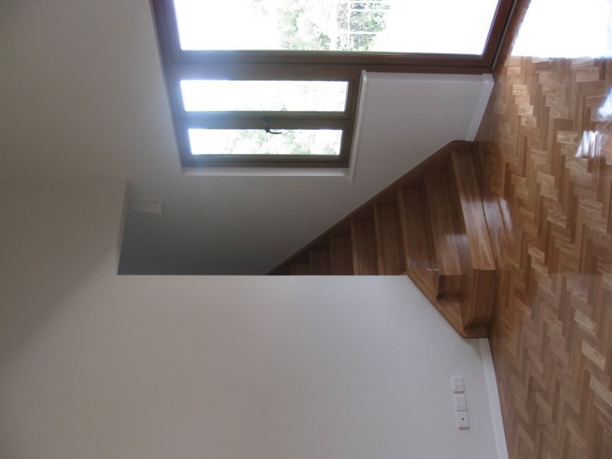 An Empty Room With A Staircase And A Window — Sven Margraf Constructions Pty Ltd In Atherton QLD