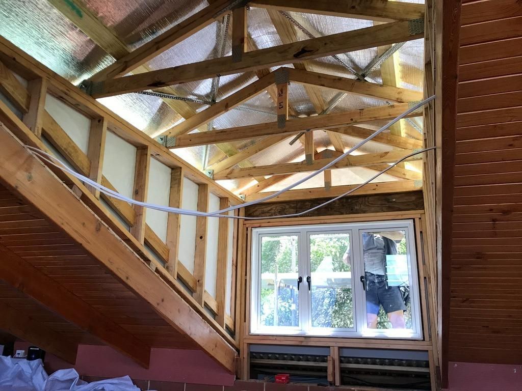 A Wooden Structure With A Window In The Middle Of It — Sven Margraf Constructions Pty Ltd In Atherton QLD