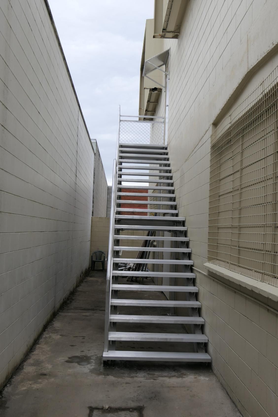 A Narrow Alleyway With Stairs Leading Up To A Building — Sven Margraf Constructions Pty Ltd In Atherton QLD