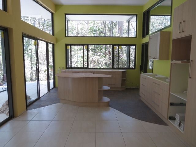 A Kitchen With A Large Island And Lots Of Windows — Sven Margraf Constructions Pty Ltd In Atherton QLD