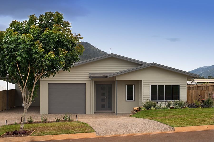 A House With A Garage And A Tree In Front Of It — Sven Margraf Constructions Pty Ltd In Atherton QLD