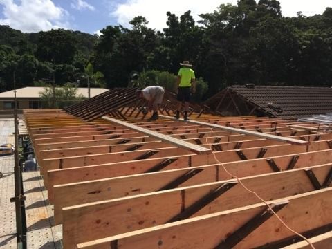 Two Men Are Working On The Roof Of A House — Sven Margraf Constructions Pty Ltd In Atherton QLD