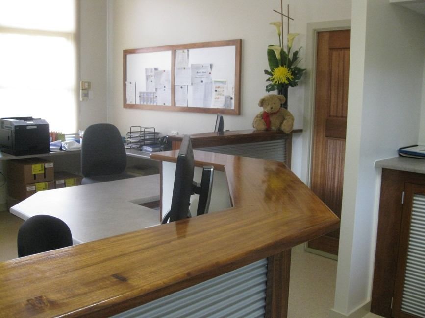 A Teddy Bear Sits On A Counter In An Office — Sven Margraf Constructions Pty Ltd In Atherton QLD