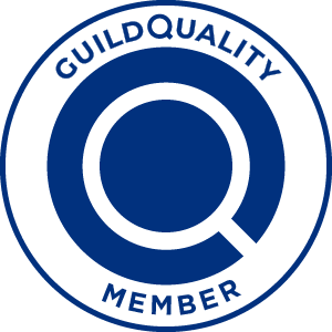 A blue and white GuildQuality member badge featuring a stylized letter Q.