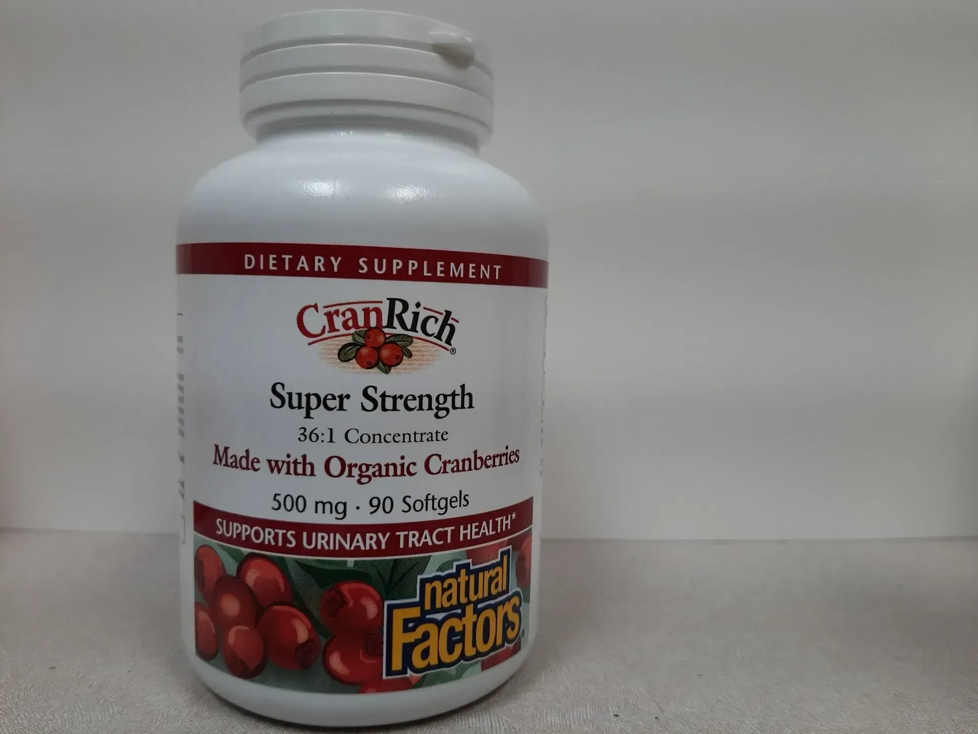 A white bottle of Natural Factors CranRich Super Strength cranberry supplement softgels.