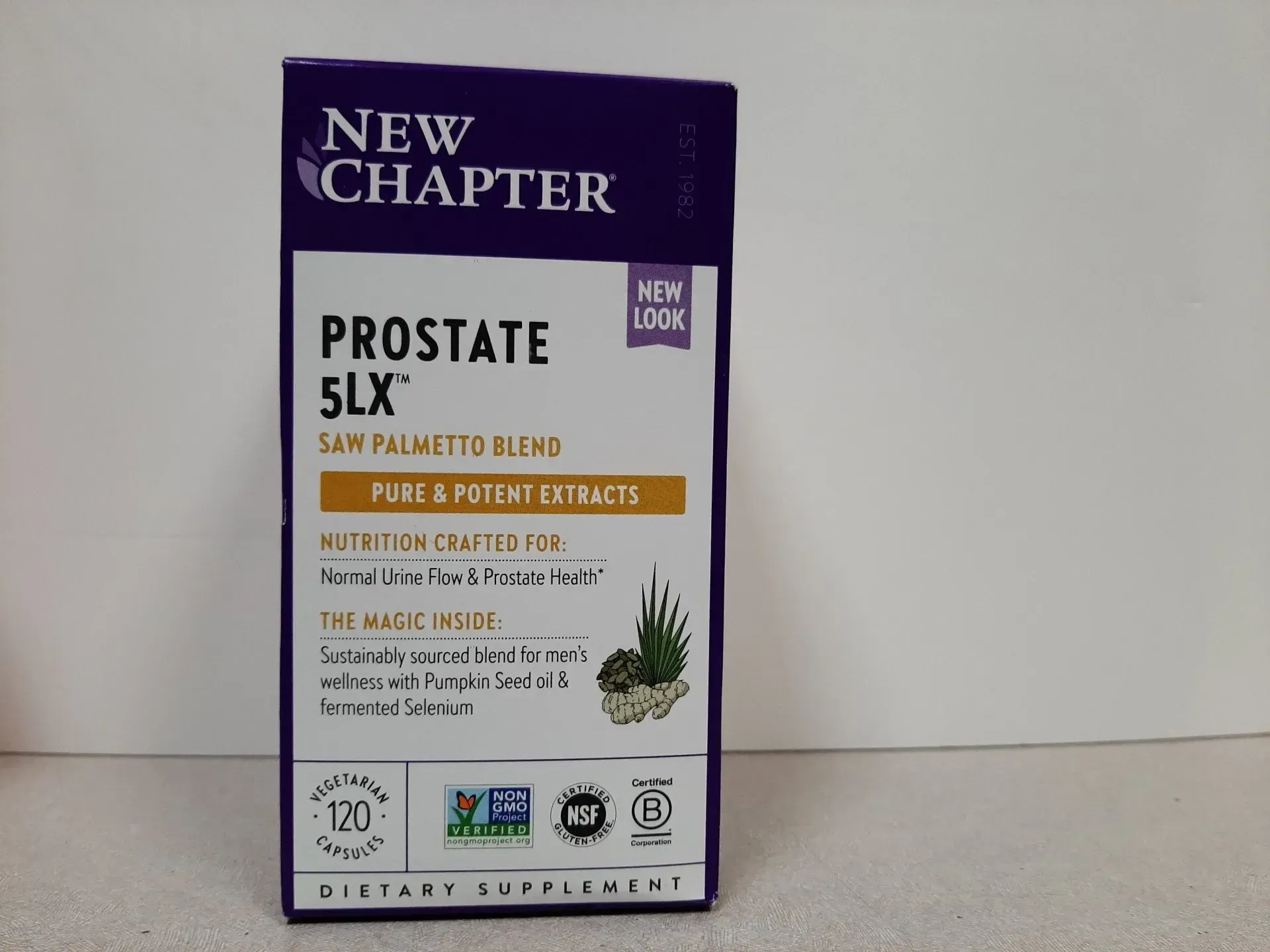 A box of New Chapter Prostate 5LX supplement, featuring purple branding, on a white surface.