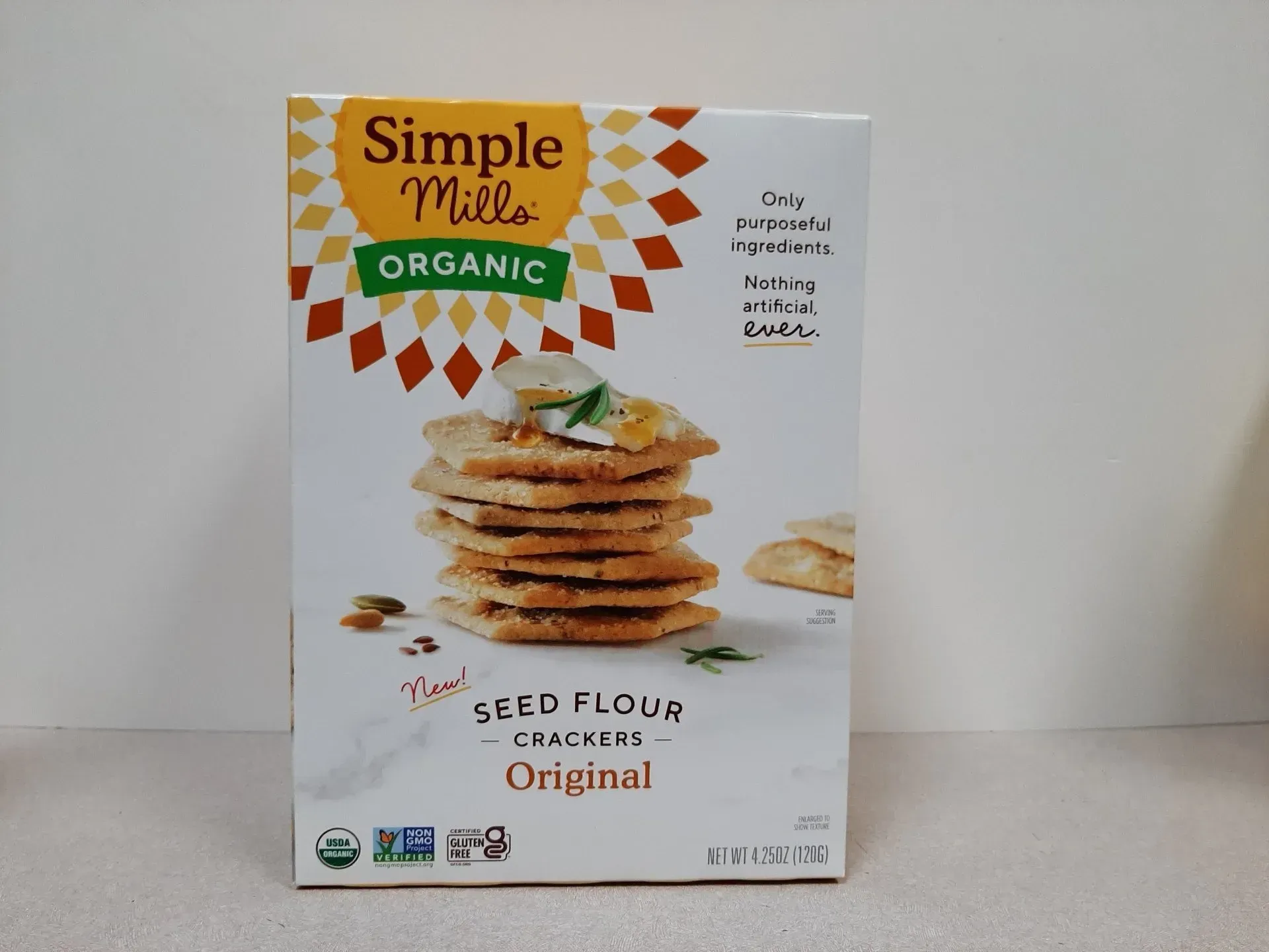 A box of Simple Mills Organic Seed Flour Crackers in the Original flavor, shown against a plain white background.
