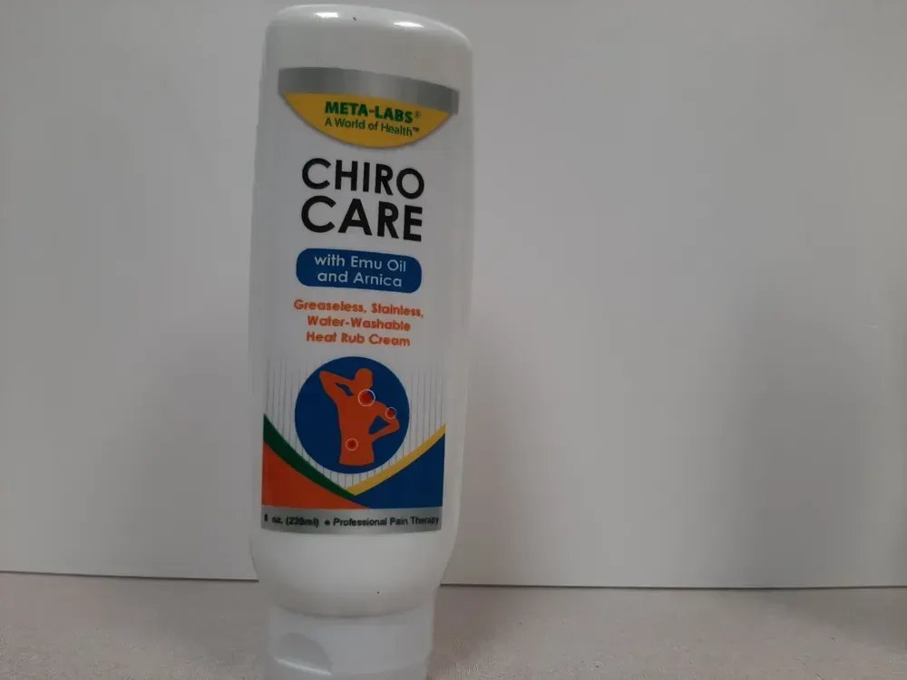 A white tube of Meta-Labs Chiro Care heat rub cream with a blue, orange, and white label showing a person in pain.