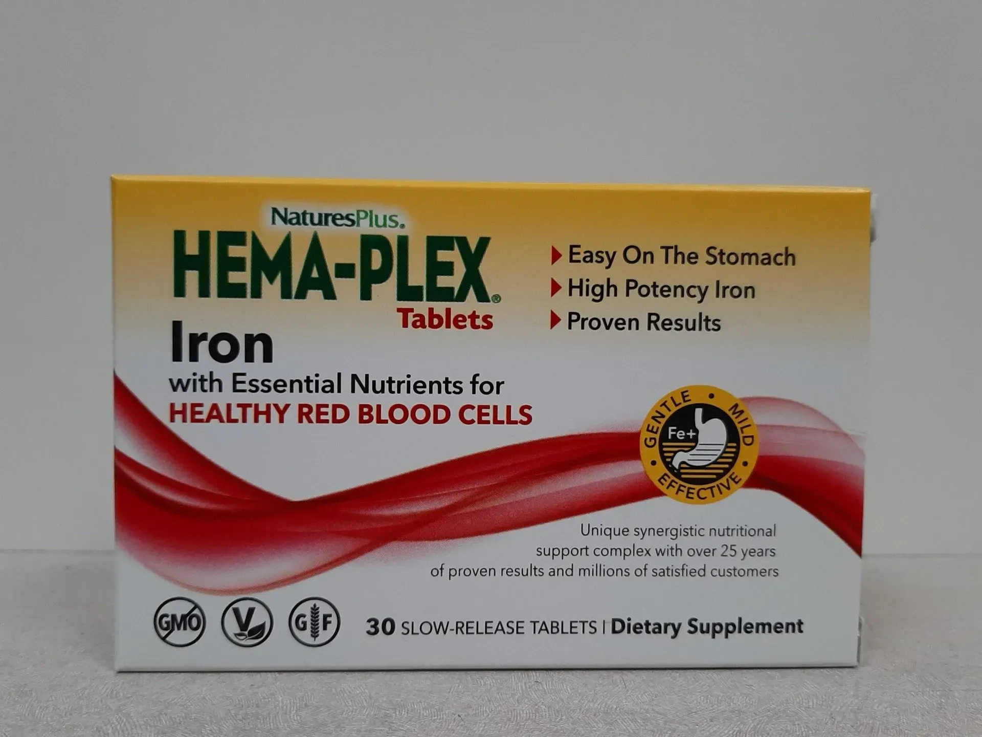 A box of NaturesPlus HEMA-PLEX iron supplement tablets against a plain background.