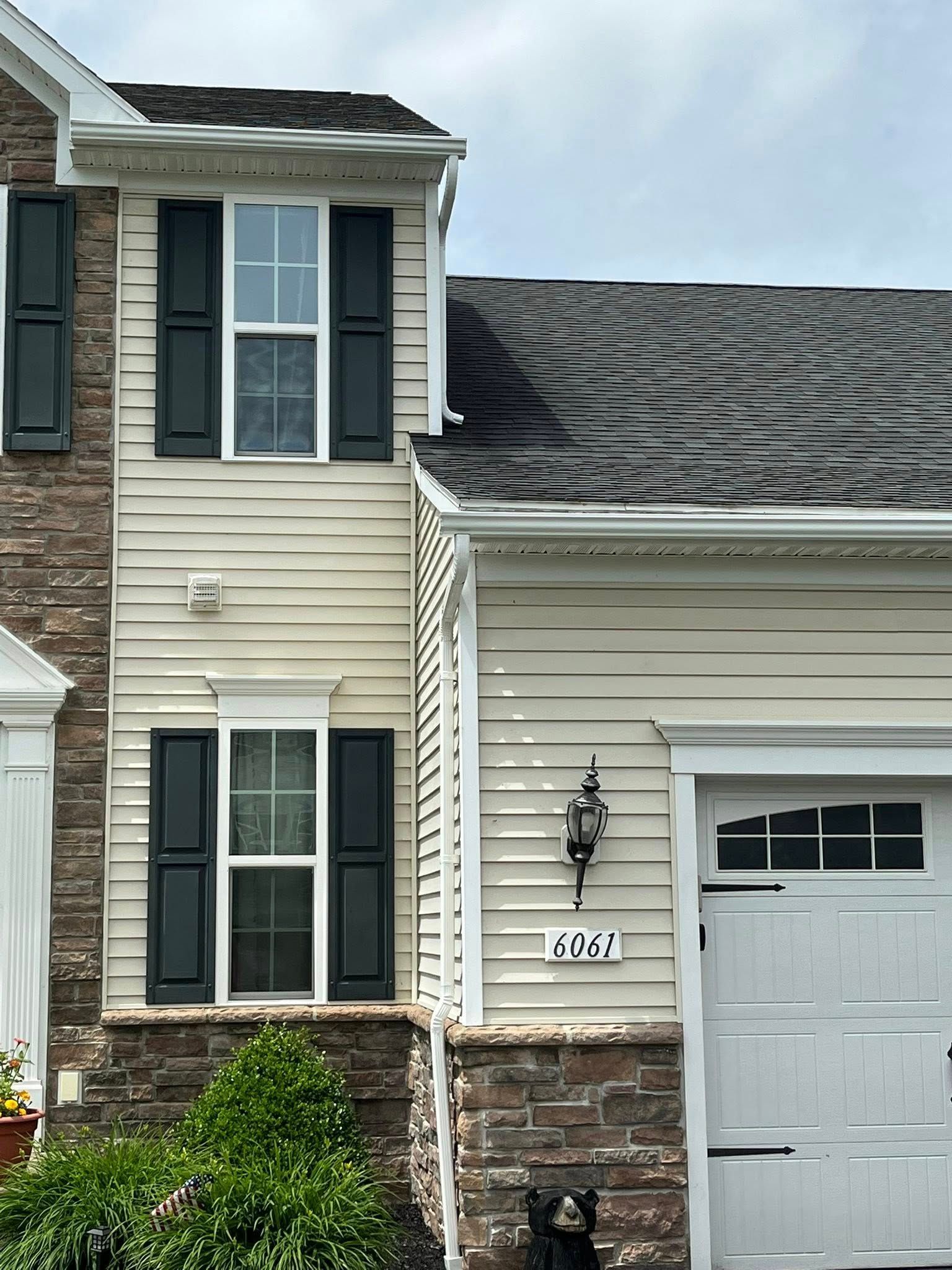 Gutters installed on two story house in Rochester area
