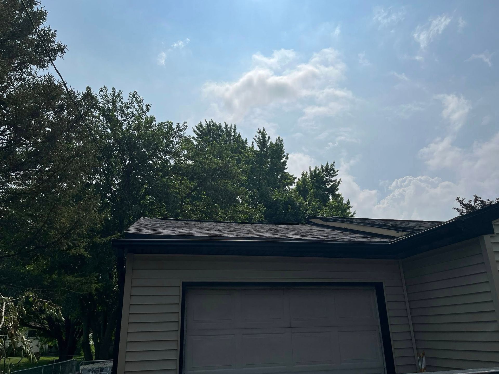 New gutters installed above a garage on a house in Rochester NY