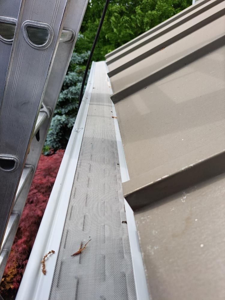 A newly installed gutter guard system in Webster, Ny