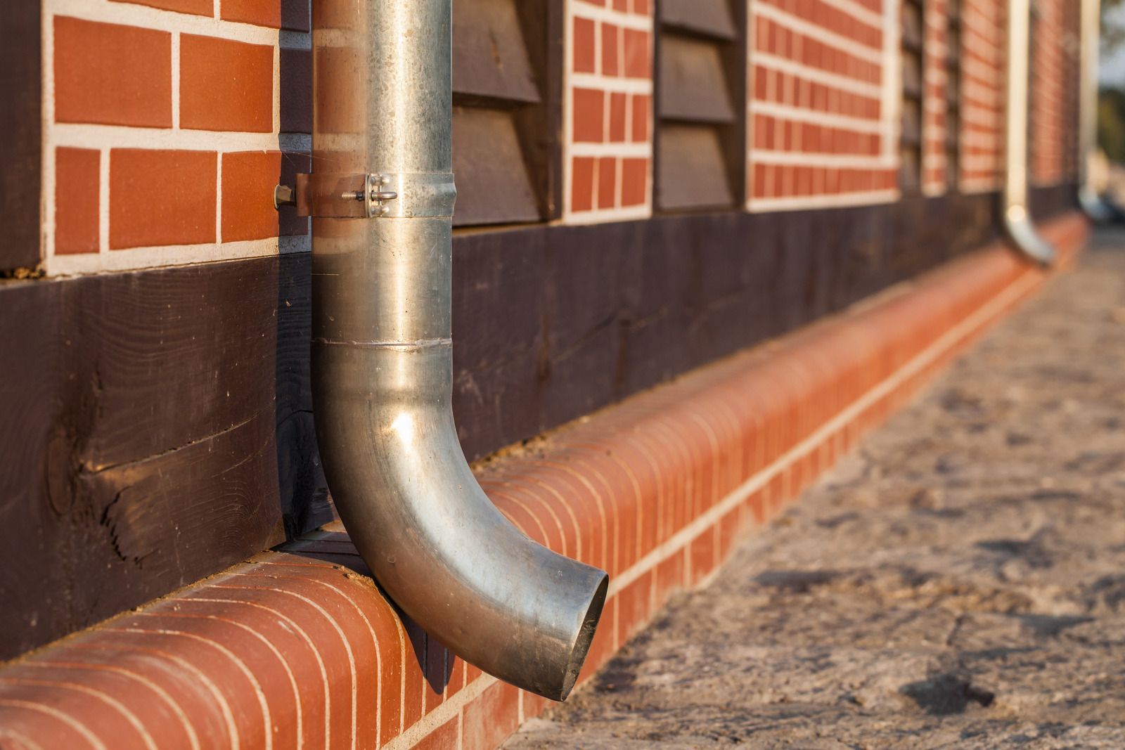Downspout on a Pittsford, NY home after gutter installation