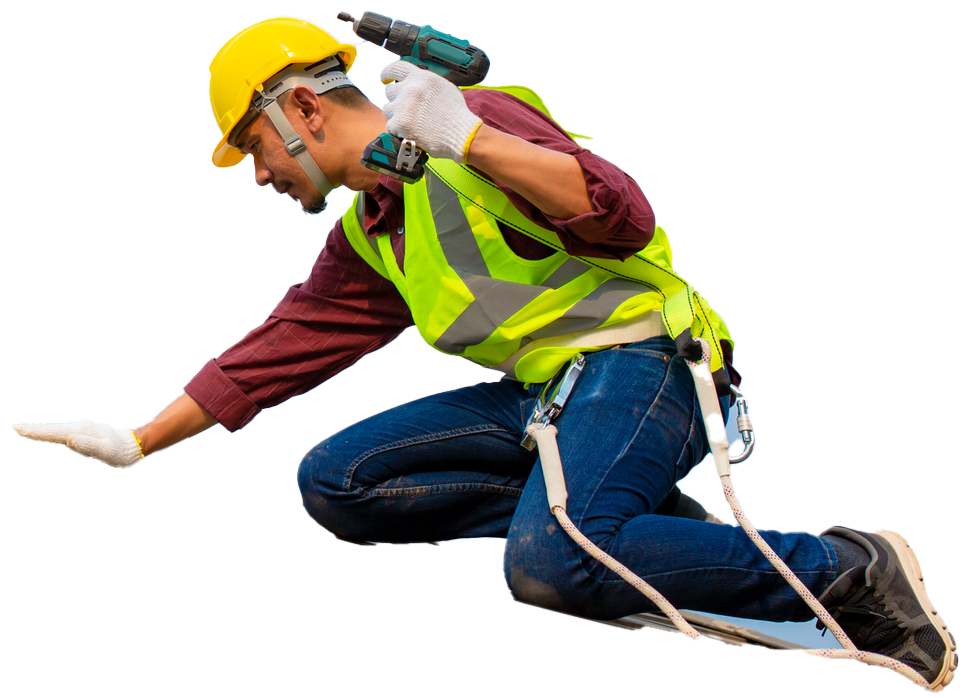 Construction worker kneeling, reaching with one hand, holding a drill, wearing a hard hat and safety vest.