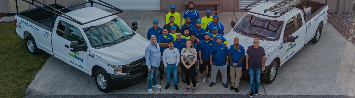 Aerial view of suburban neighborhood with houses, a highway, and a small pond.