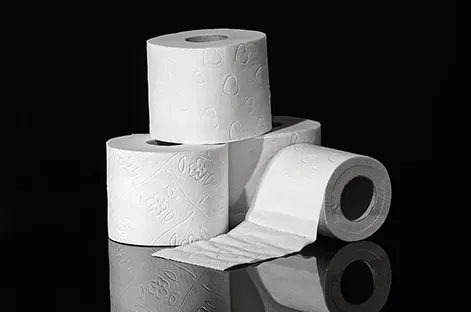 Rolls Of Toilet Paper Is Sitting On A Black Surface — Sunchem Quality Cleaning Products In Gympie, QLD