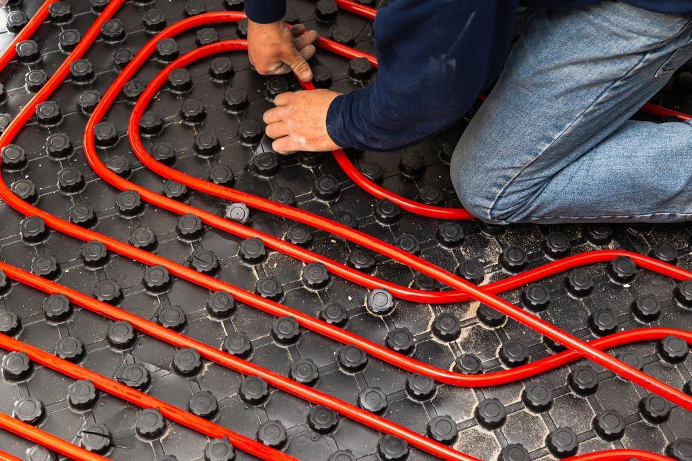 Installing Tubes of Radiant Underfloor Heating — Sydney Underfloor Heating in Canberra, NSW