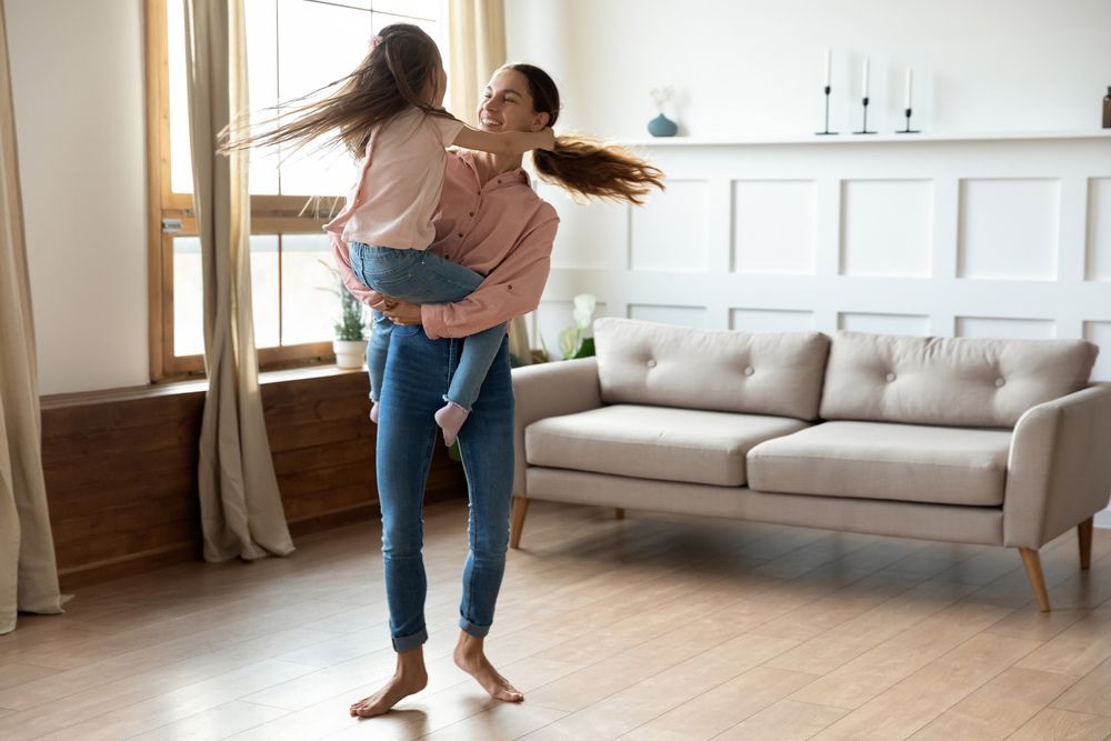 Mother and Daughter Enjoying the Newly Installers Underfloor System — Sydney Underfloor Heating in Illawarra, NSW