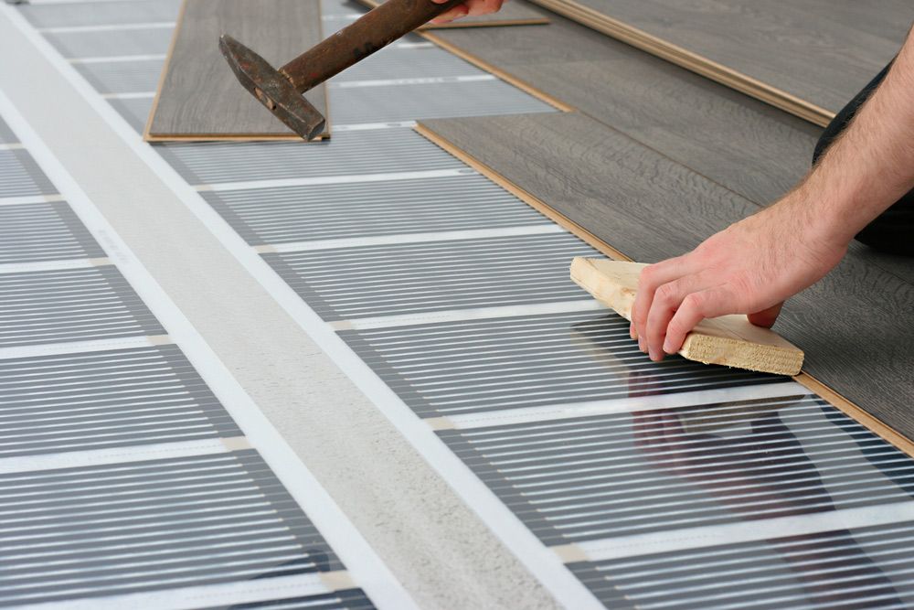 Installing Laminated Floor over Heating System — Sydney Underfloor Heating in Goulburn, NSW