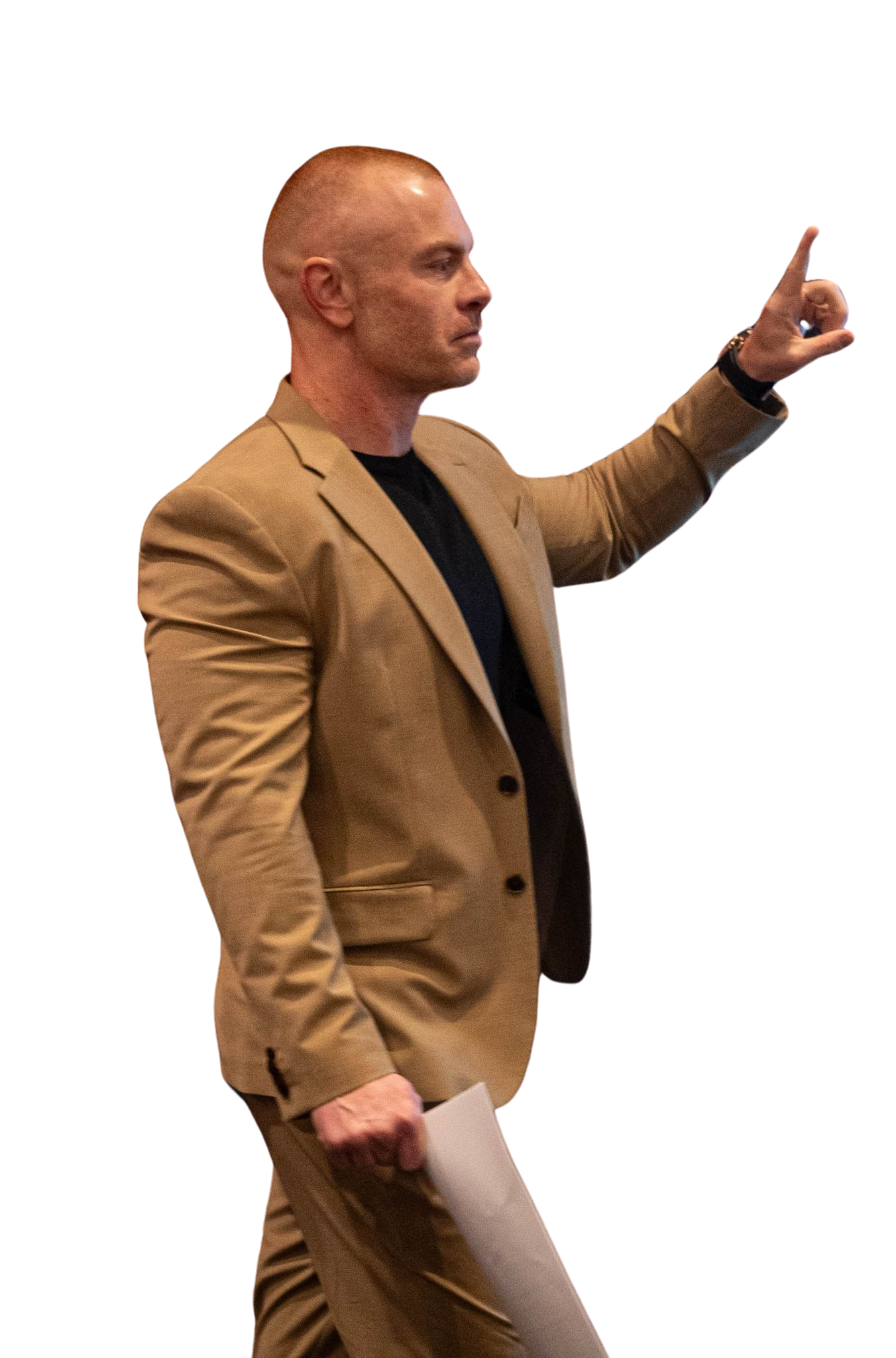 A man with a tattoo on his arm is pointing at the camera.