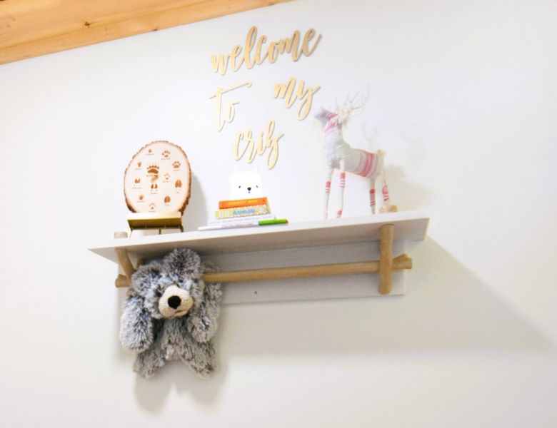 Shelf on white wall with gold 