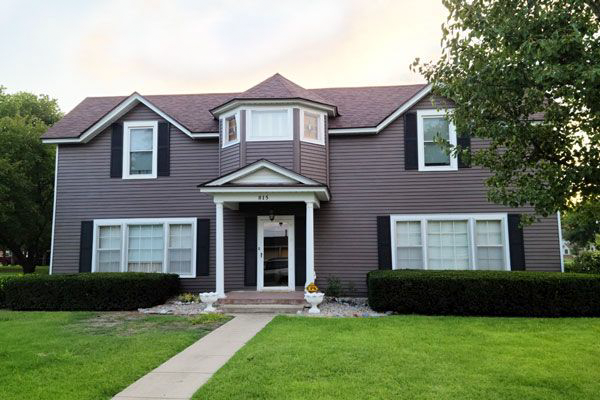 A large house with a walkway leading to it