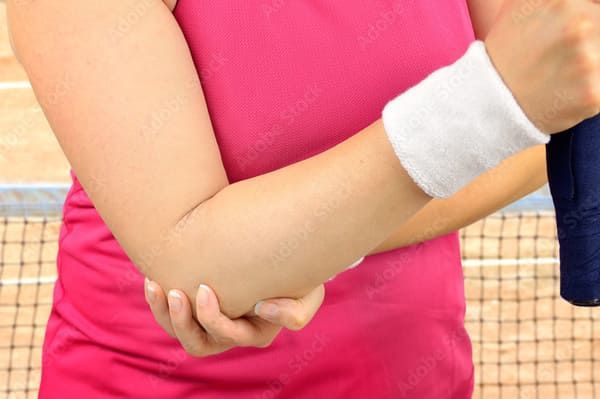 woman with tennis elbow pain