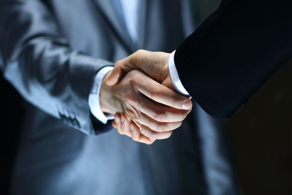 Handshake to symbolize the partnership between PC Controls and their valued distributors 