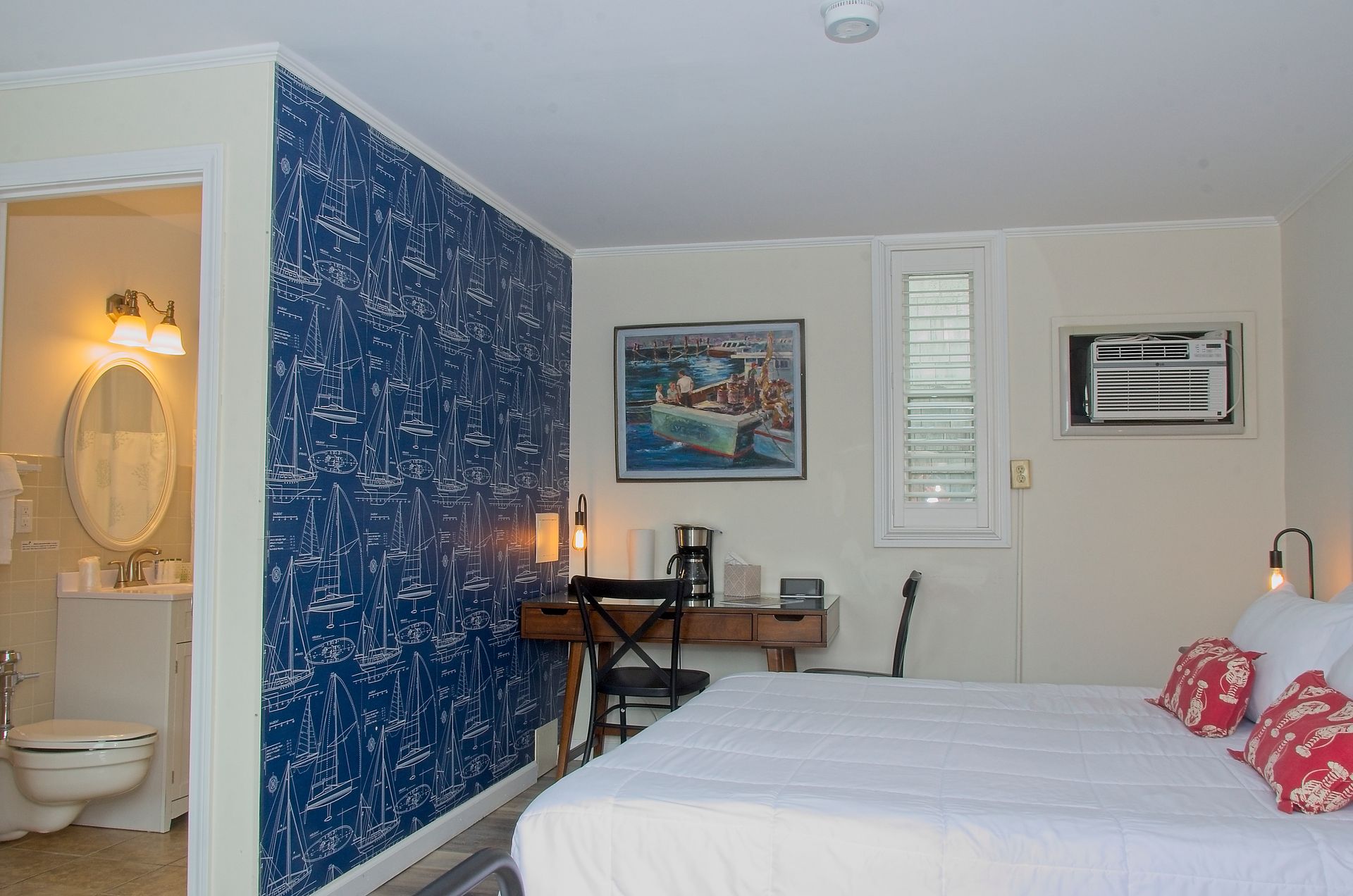 A living room with a wooden counter and a blue couch