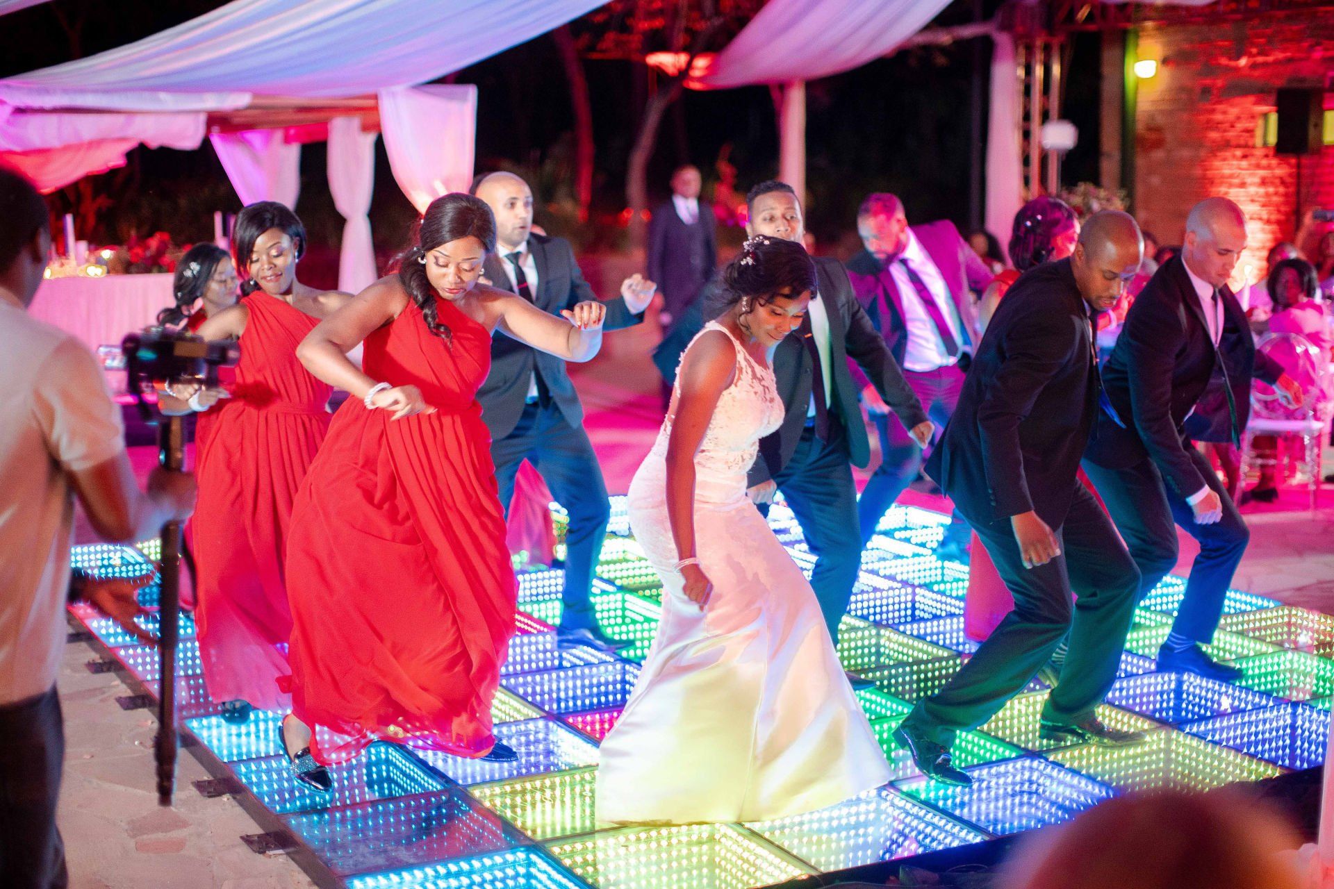 Bride Groom and Bridal Party Having Fun Dancing at Zimbabwe Wedding by Elysian Event Productions