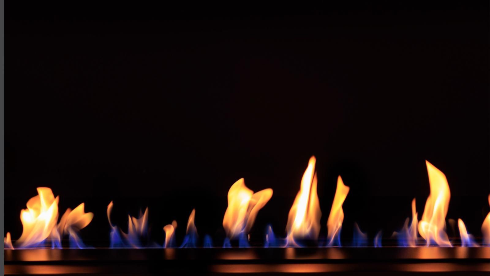 Gas fireplace flames on a black background.