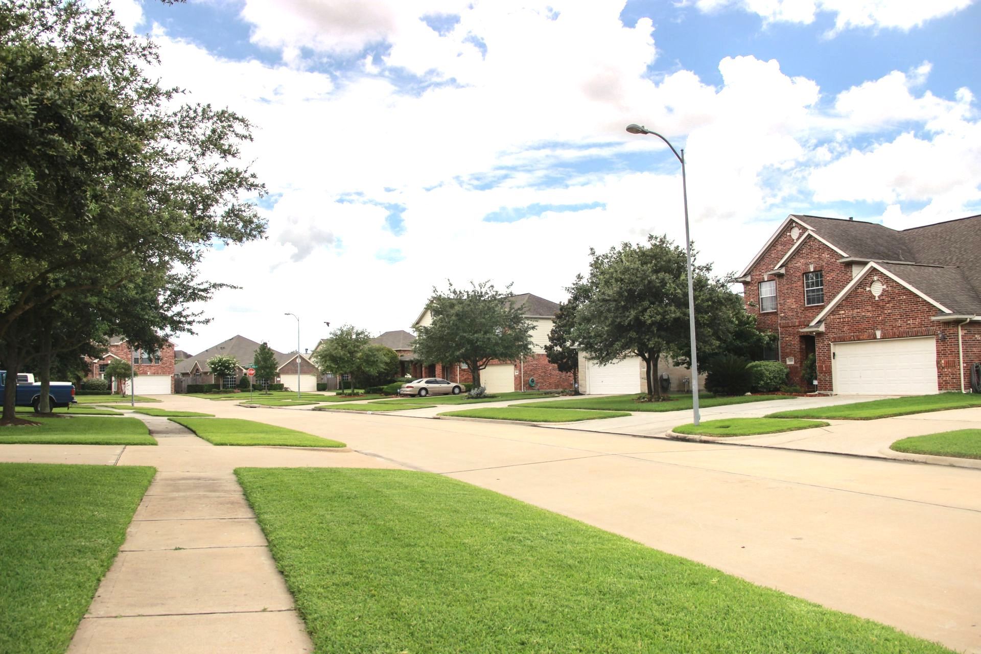 A row of houses in a residential neighborhood on a sunny day