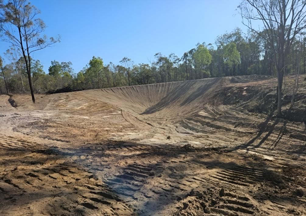 A Dirt Field With Trees — Greenslade's Dozer & Excavator Hire Pty Ltd In Wondai, QLD