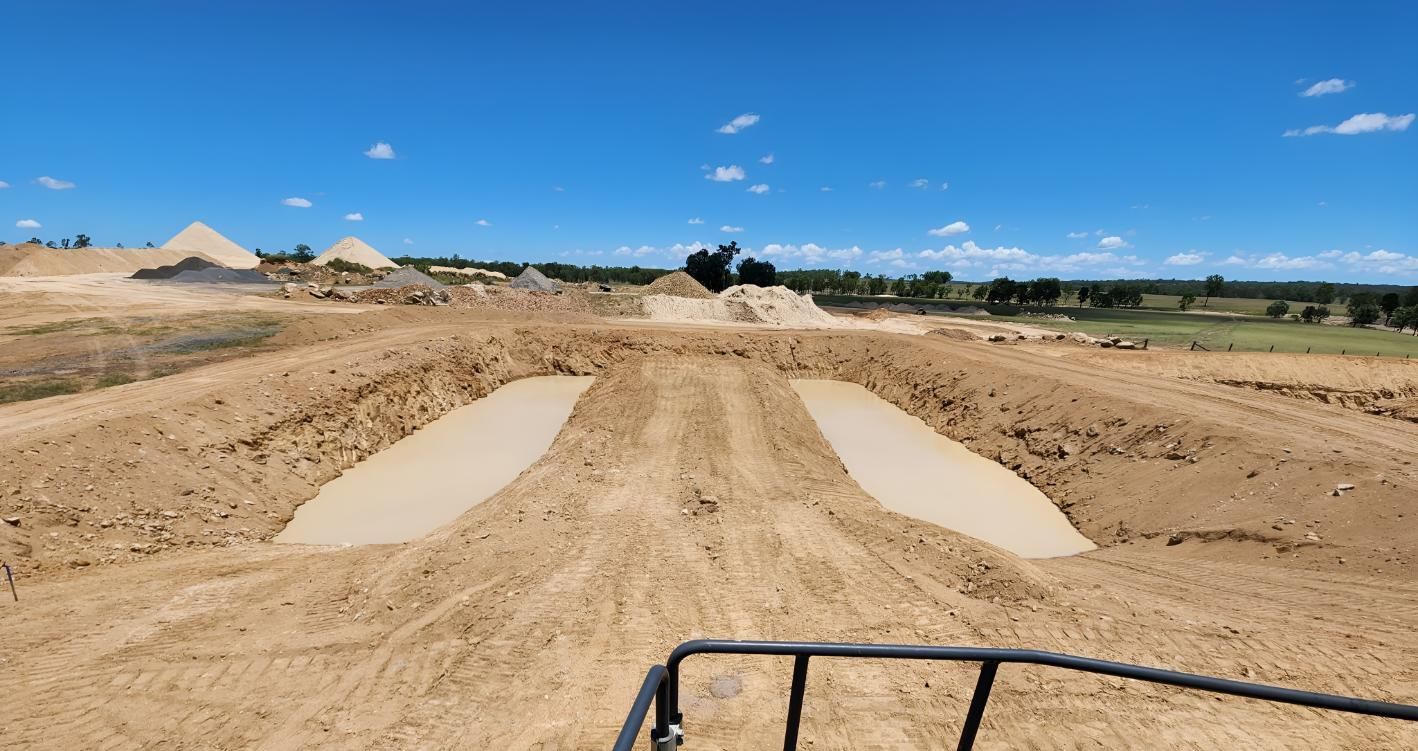 A Large Dirt Field In The Making Of A Dam — Greenslade's Dozer & Excavator Hire Pty Ltd In Taabinga, QLD