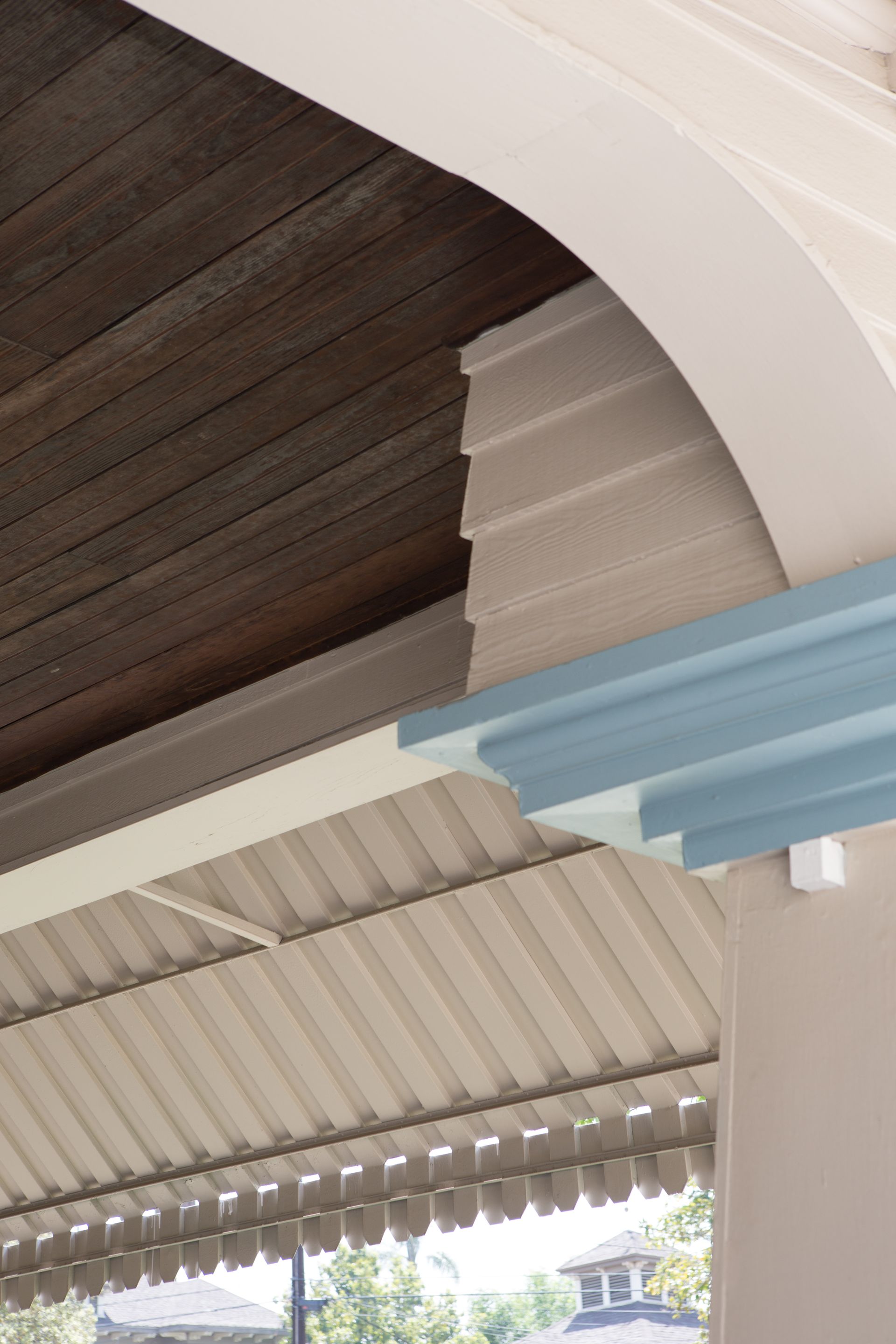 The ceiling of a building with a blue trim