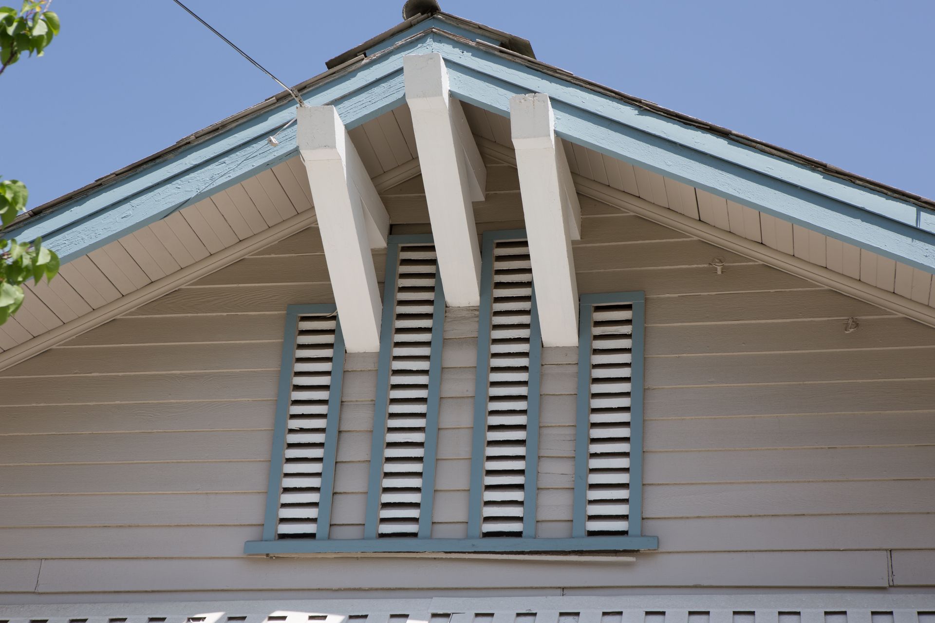 The roof of a house with shutters on it