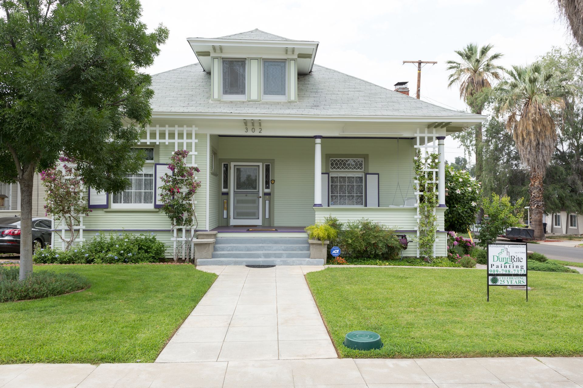A house with a sign in front of it that says 