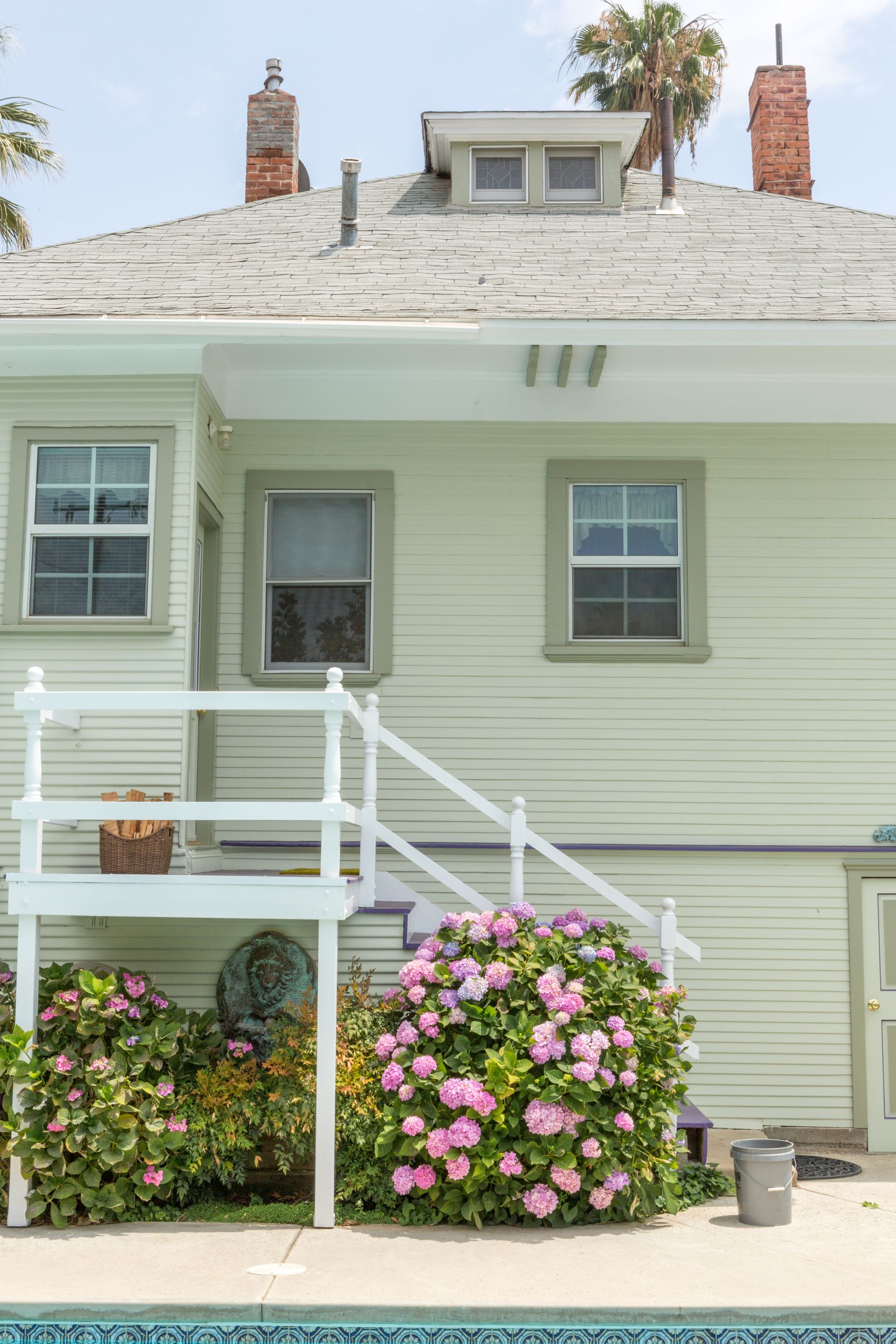 A house with a swimming pool in front of it