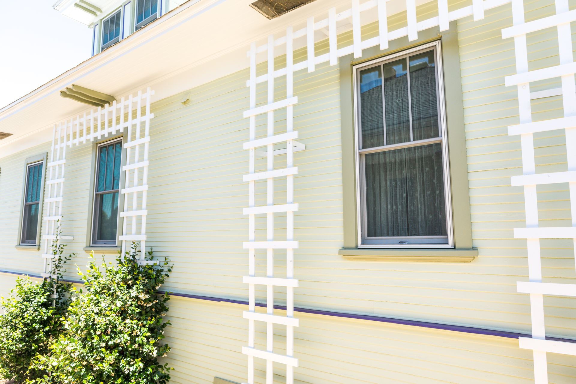 A house with white ladders on the side of it