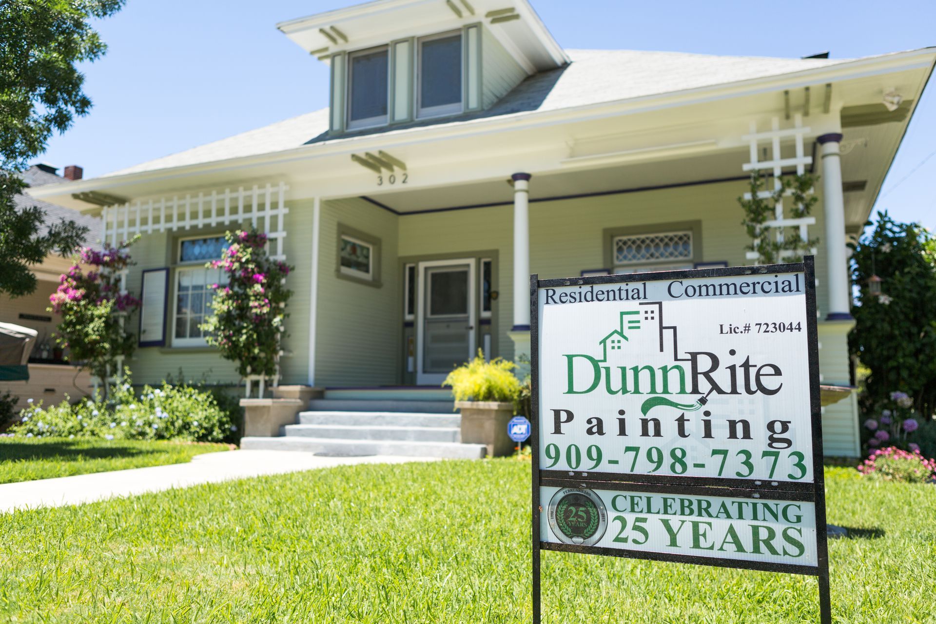 A house with a dunrite painting sign in front of it