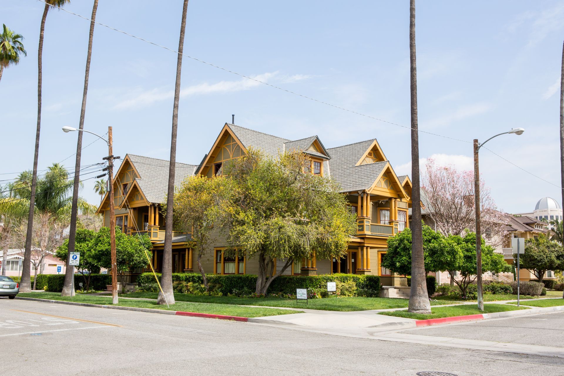 A large house with palm trees in front of it
