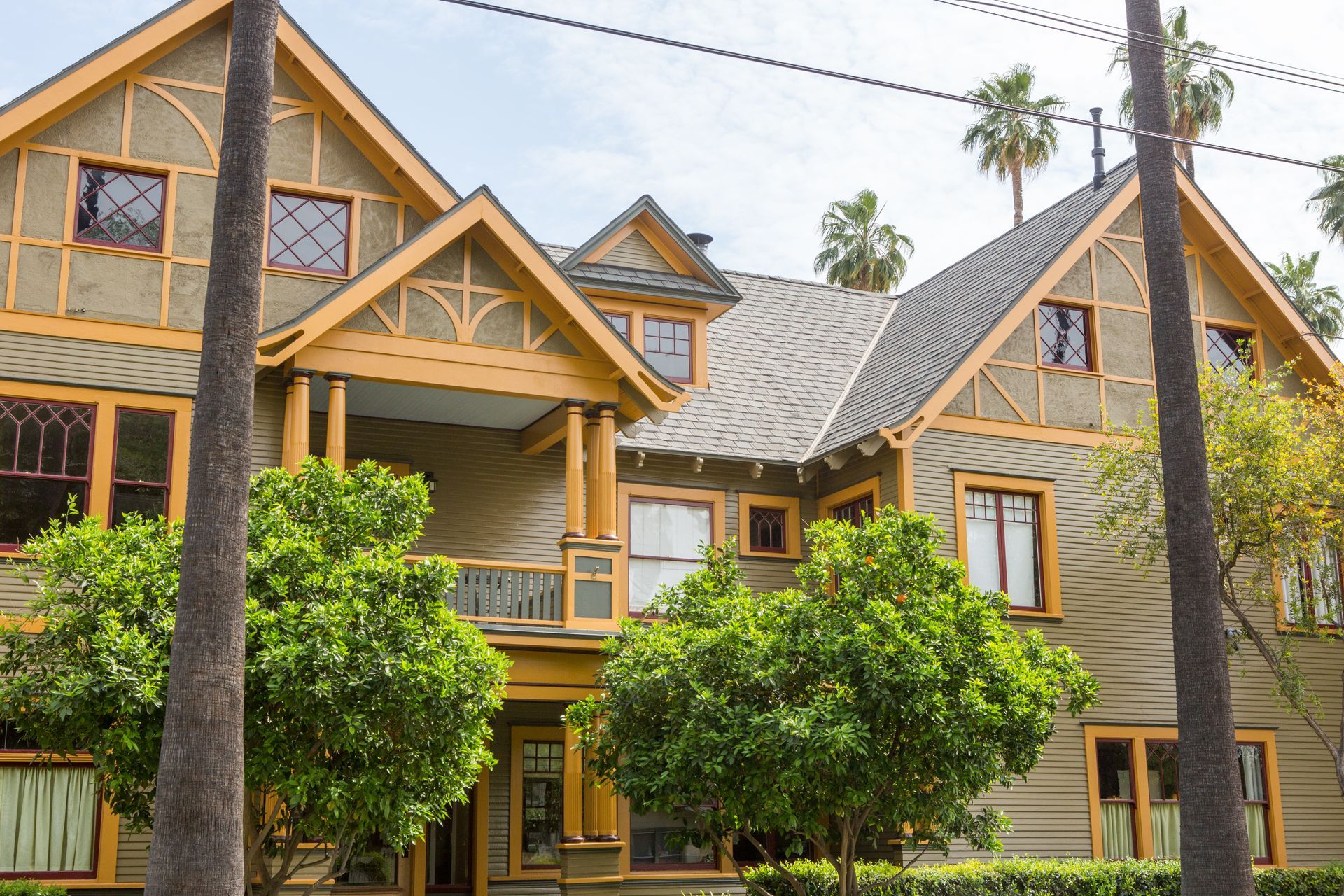 A large house with palm trees in front of it