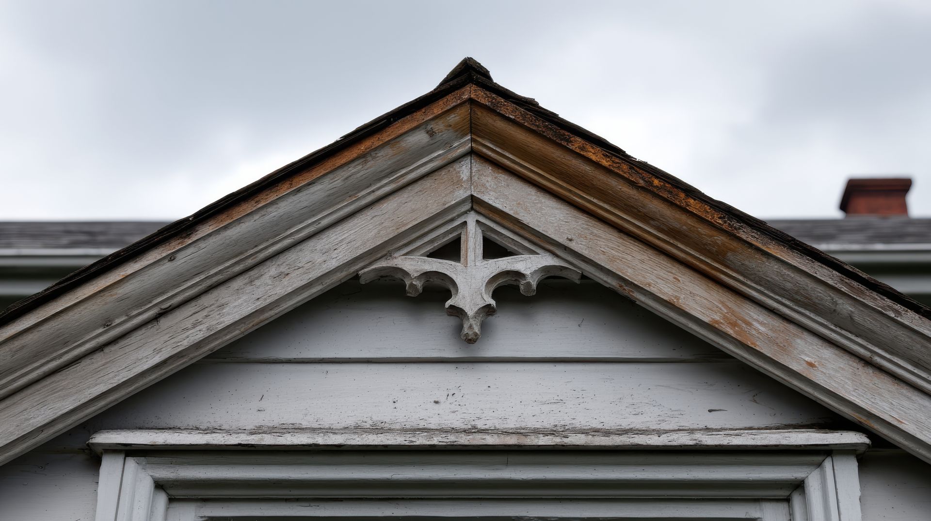 The roof of a house with a cross on it