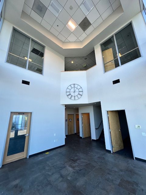 A large room with a clock on the wall