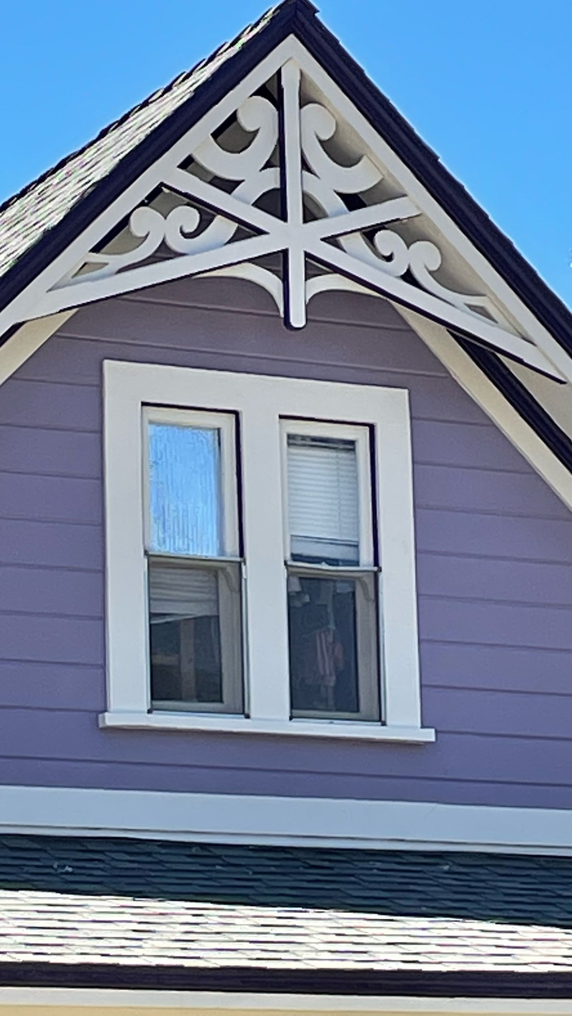 The roof of a house with a cross on it