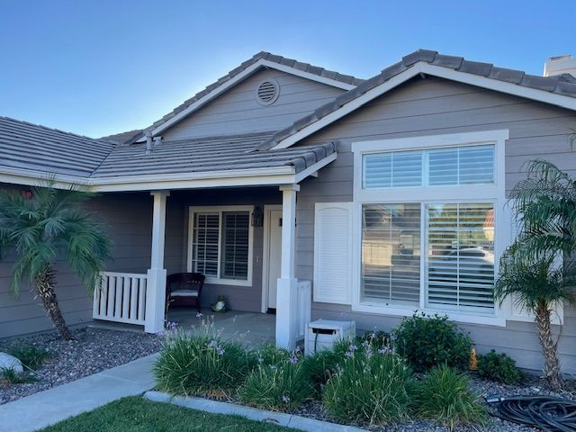 A house with a porch and a lot of windows
