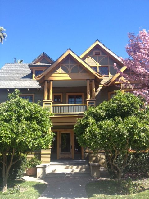 A large house with a lot of trees in front of it