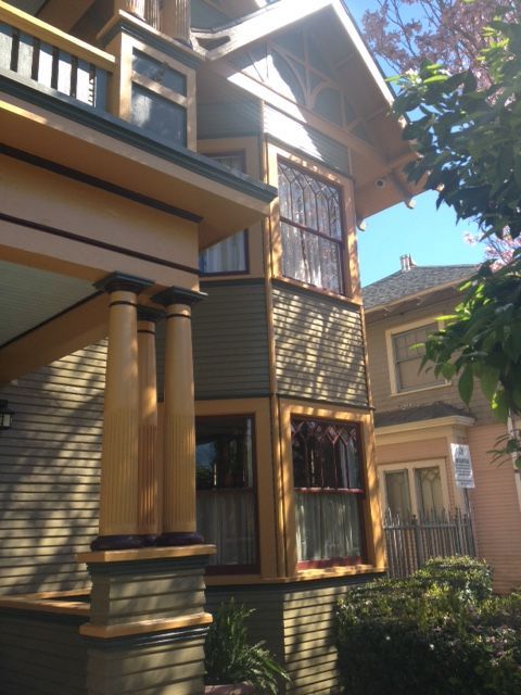 A house with a lot of windows and a balcony
