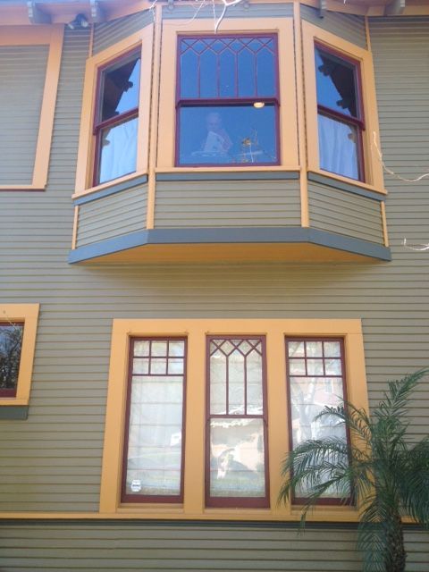 A house with a lot of windows and a balcony